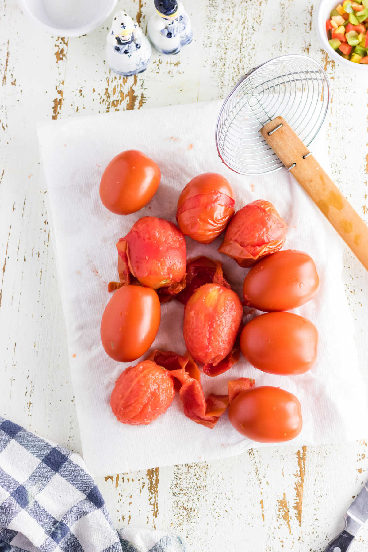 Tomatoes being drained on paper towel.