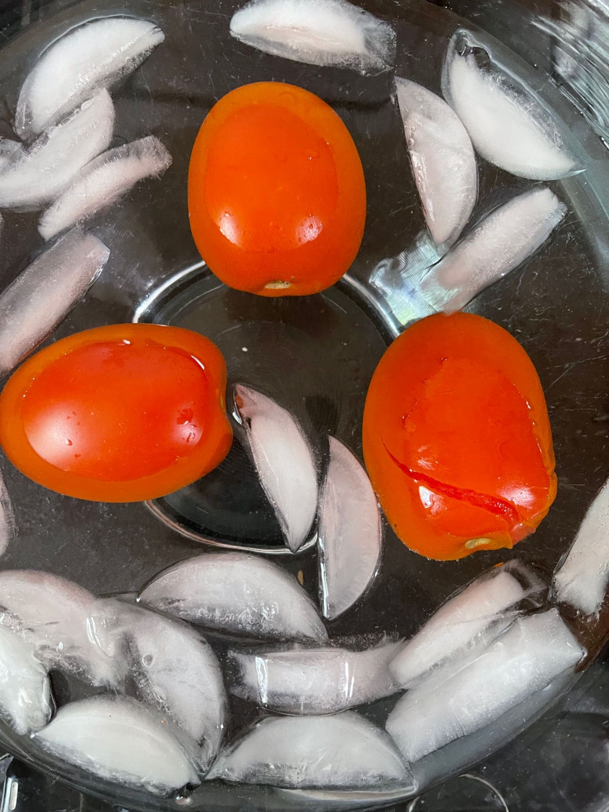Tomatoes in an ice bath before peeling.