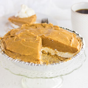 Closeup of the pie with a slice removed to show layers for the feature image.