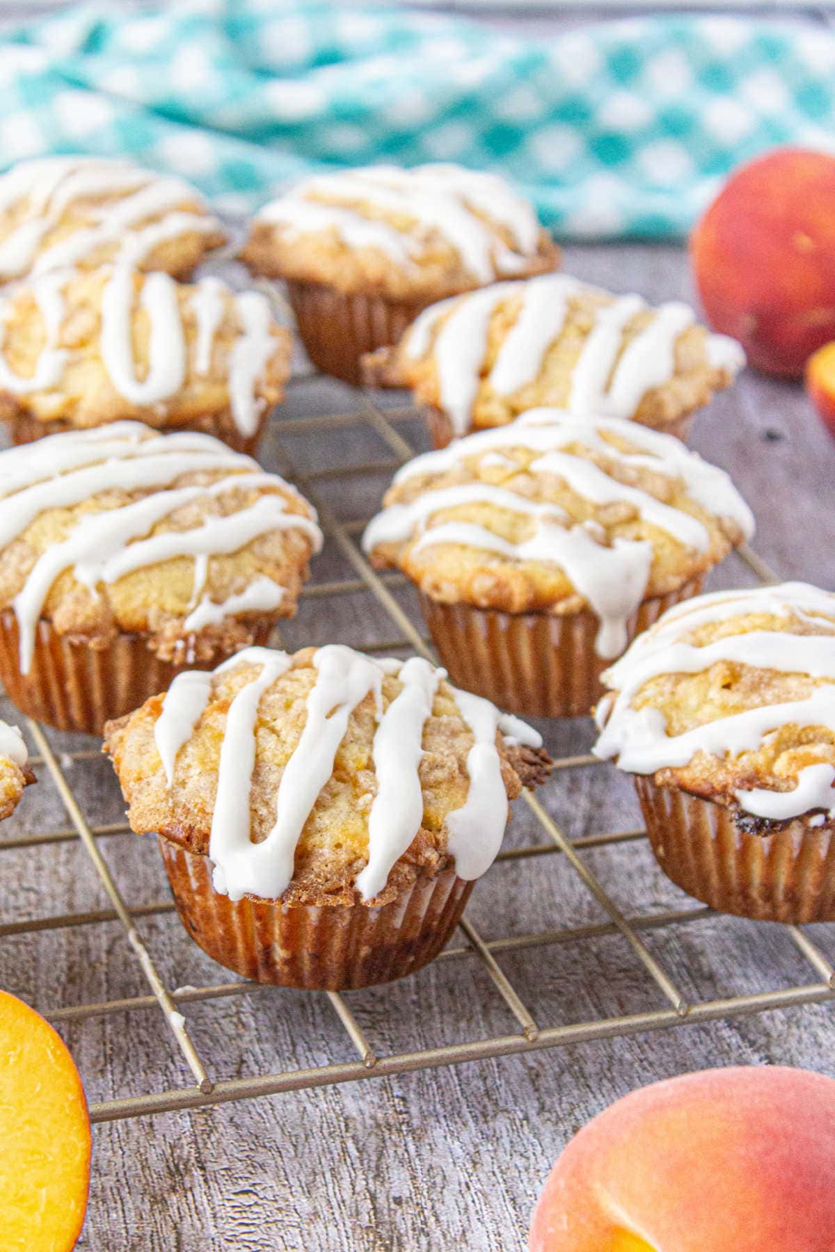 Peach muffins cooling on a rack.