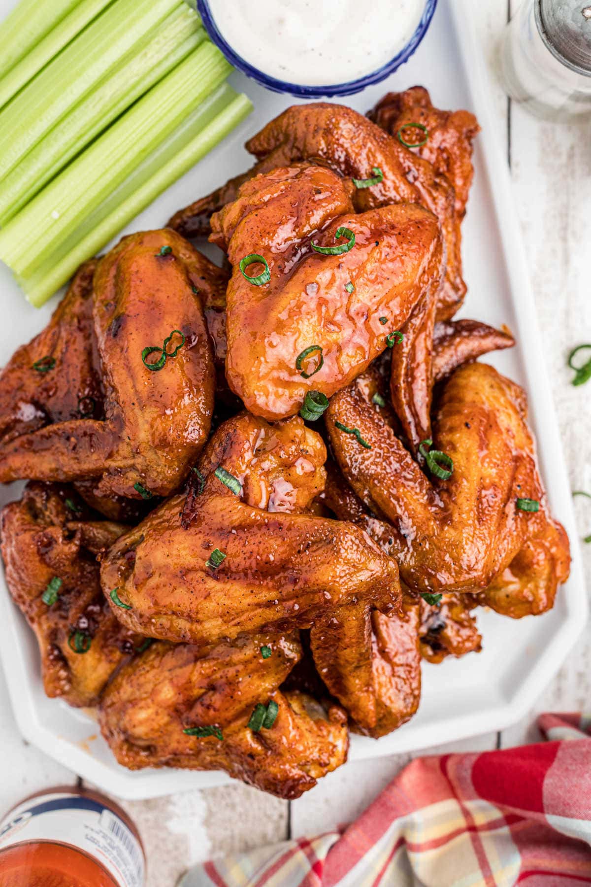 Closeup of finished chicken wings in a spicy bbq sauce.