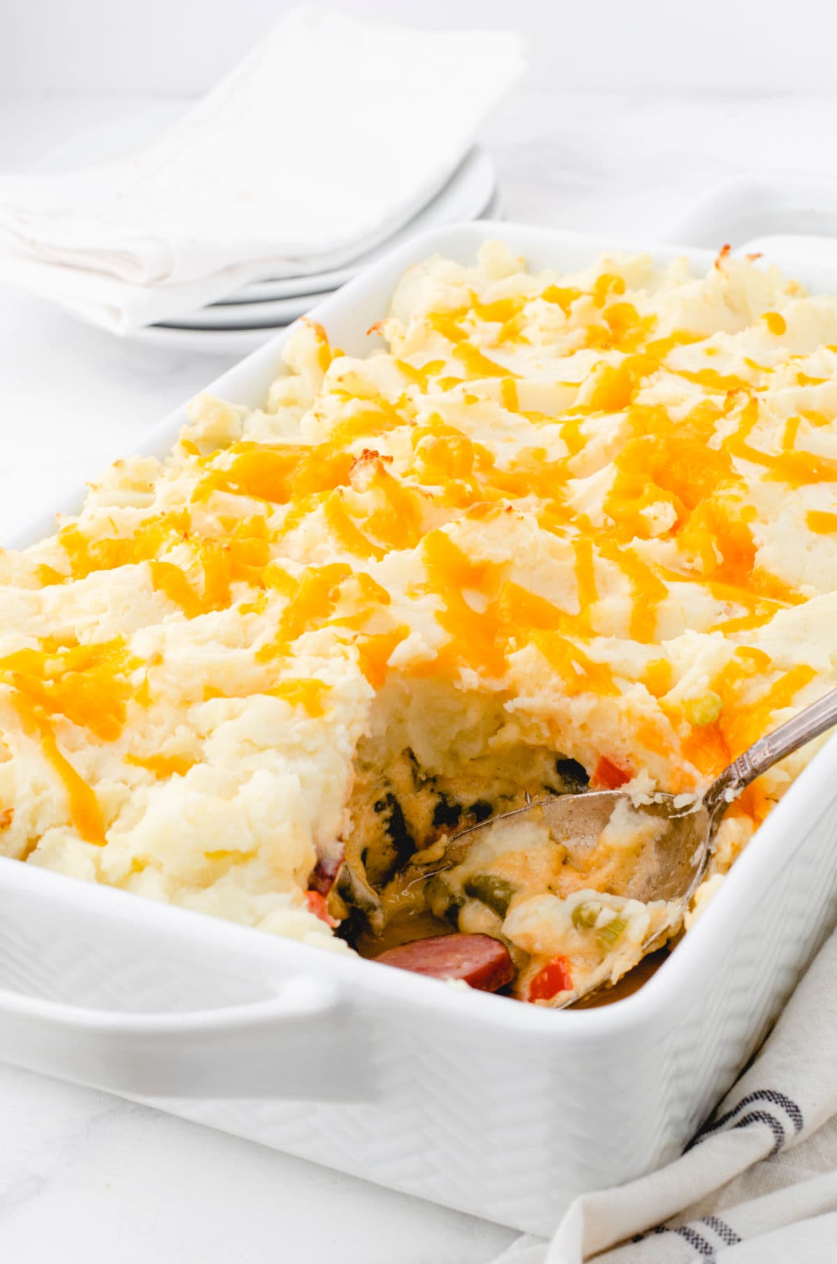 Casserole with one serving removed to show the layers.