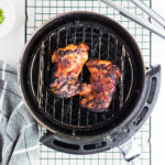 Closeup of the finished chicken thighs showing the sticky bbq coating.