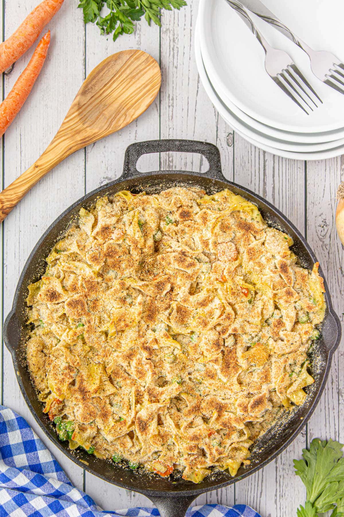 Overhead view of finished chicken & noodles in an iron skillet.