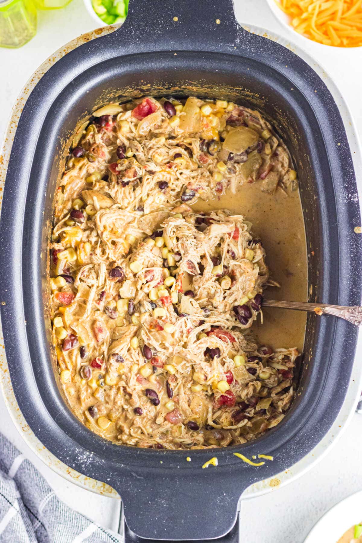 Overhead view of the slow cooker filled with chili.