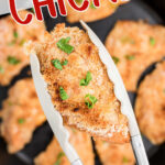 Deviled chicken being picked up with tongs has a text overlay for Pinterest.