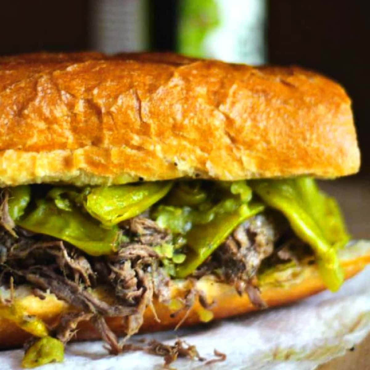 Closeup of an Italian beef sandwich with peppers.