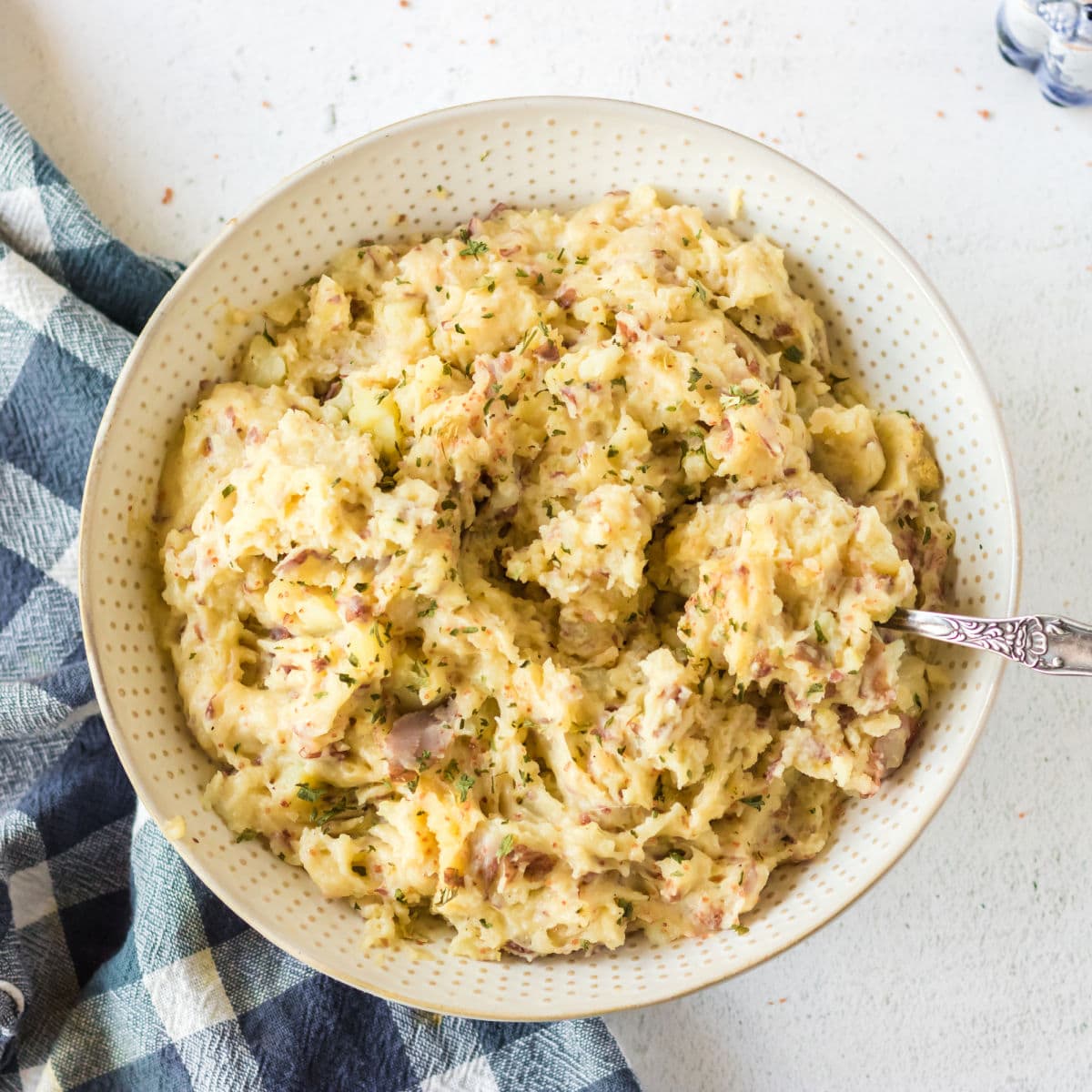 Overhead view of a bowl of garlic mashed potatoes for feature image.