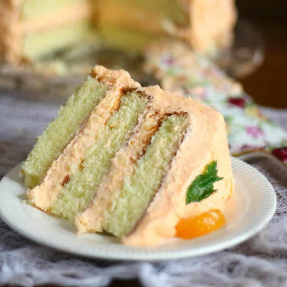 Slab of layer cake with thick filling and frosting.