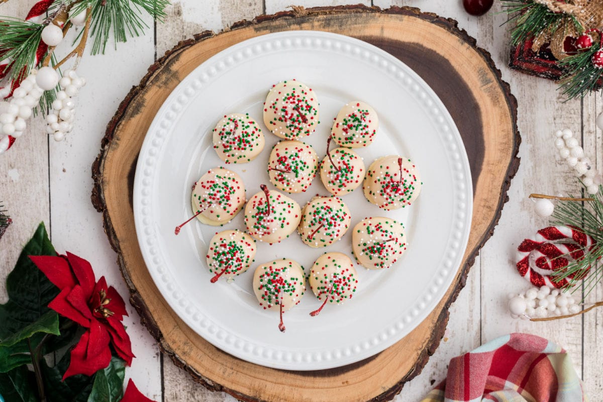 Chocolate covered cherries decorated for the holidays.