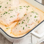 Feature image chicken and gravy in a casserole dish.