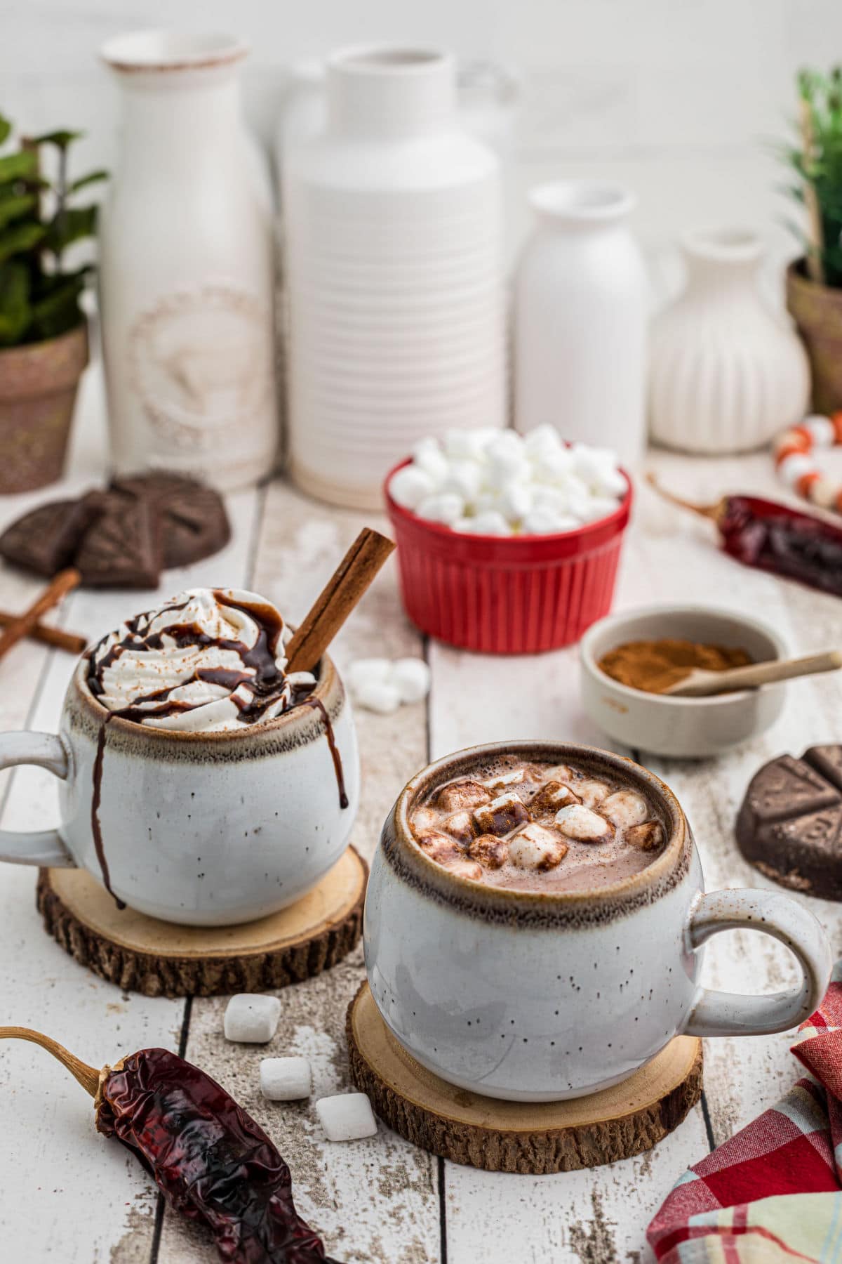 Cups of hot chocolate on a table waiting to be sipped.