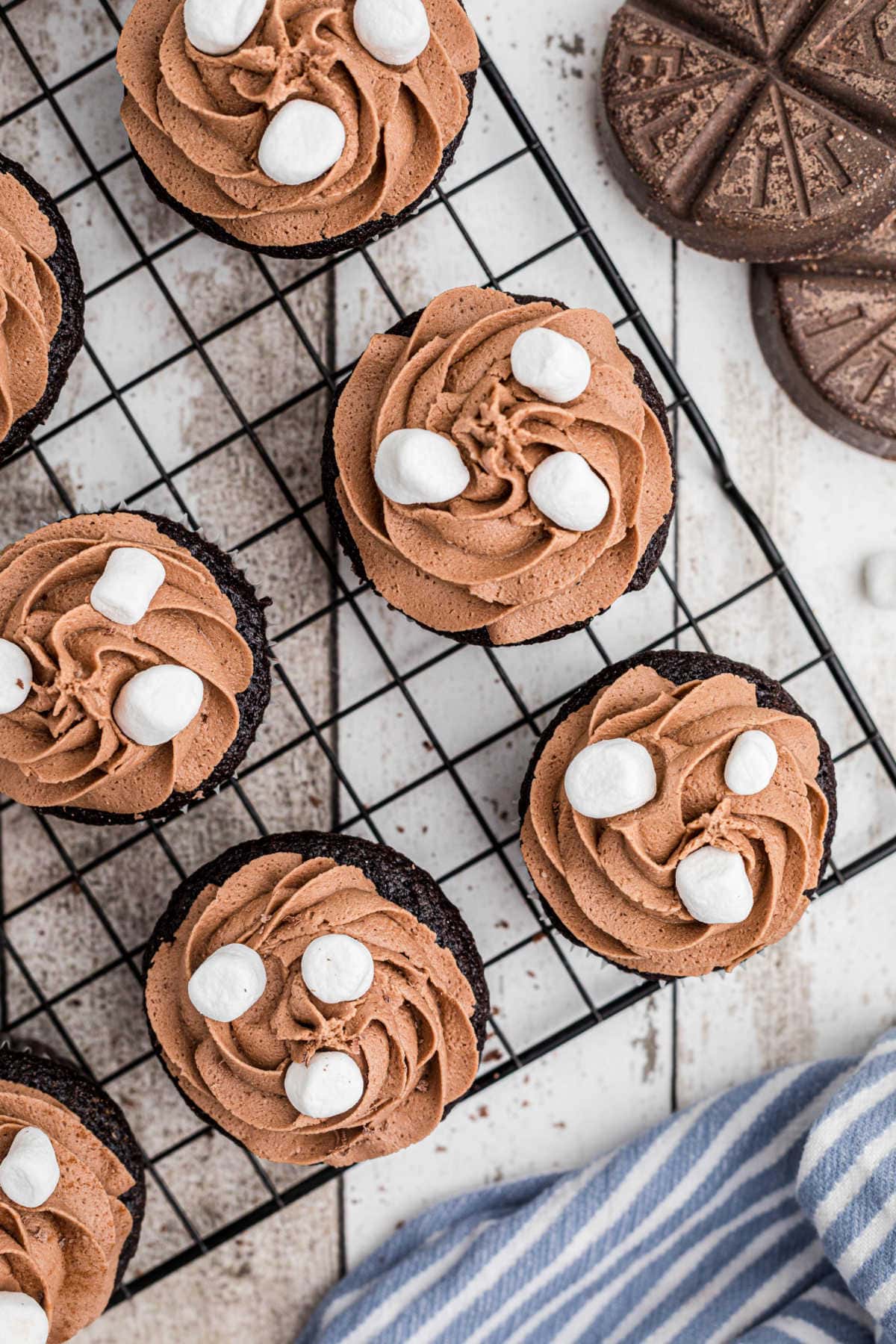 Overhead view of finished cupcakes with marshmallows on top.