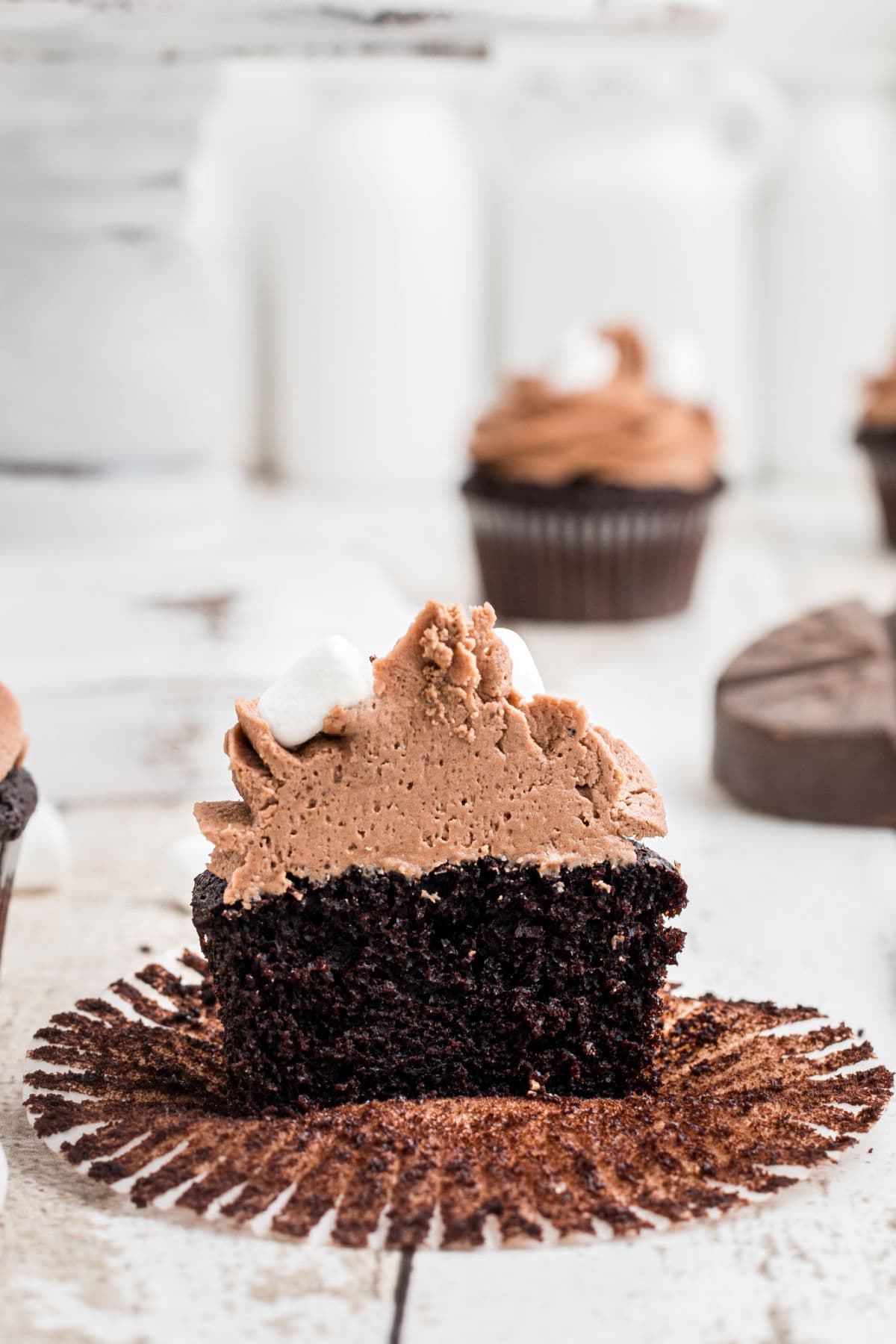 Cupcake sliced in half to show the interior cake.