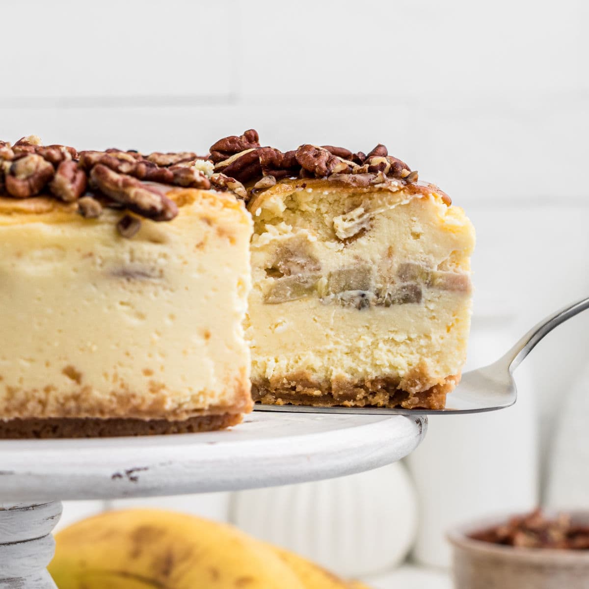 Feature image showing the layers of cheesecake and bananas.