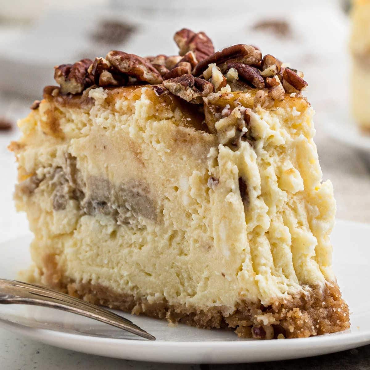 A closeup of a slice of southern banana pudding cheesecake showing the creamy texture.