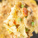 Chicken noodle casserole in a skillet with text overlay for Pinterest.