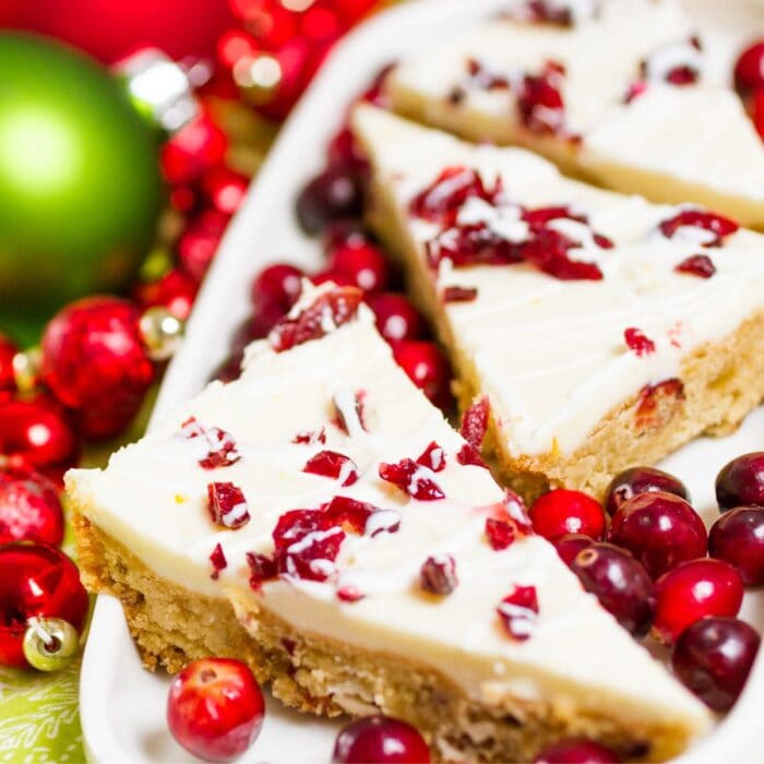 Closeup of a cookie bar with cranberries and white chocolate.