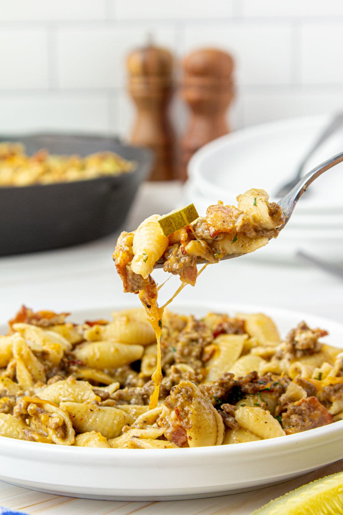 Forkful of pasta being removed from a plate.