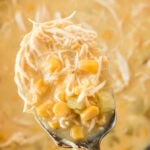 Chicken corn chowder in a serving spoon with text overlay for Pinterest.