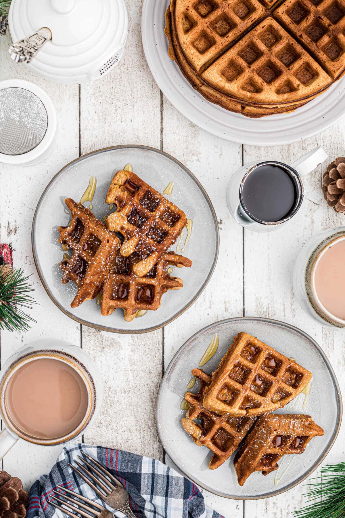 Plates with waffles on them.