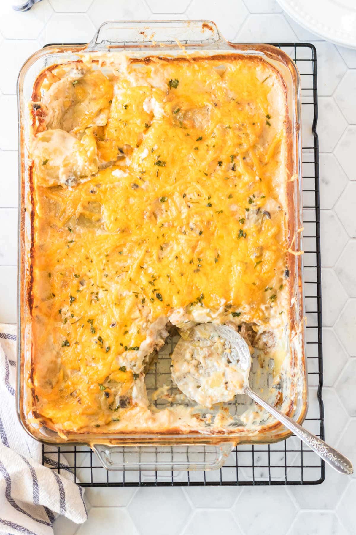 Hamburger potato casserole with a serving taken out.