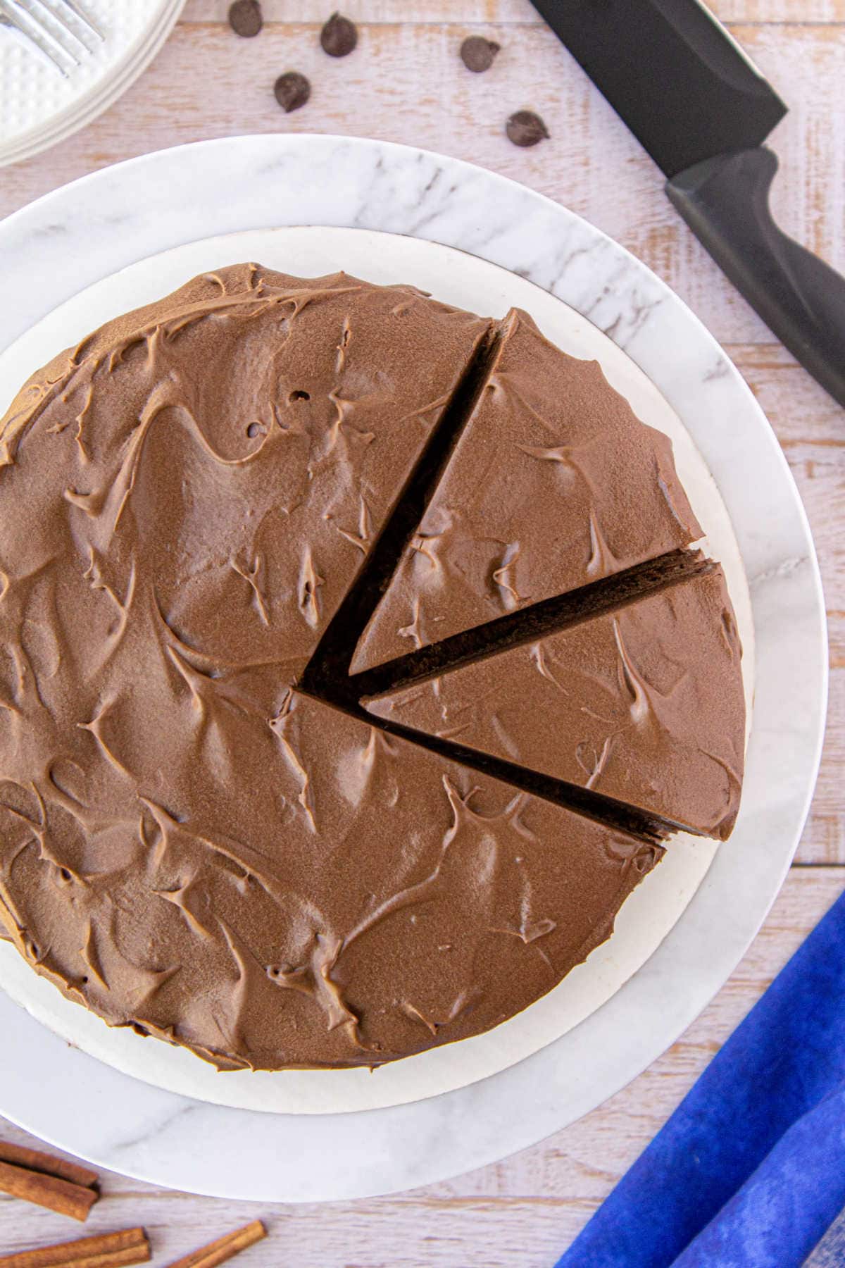 Overhead view of cake being cut.