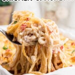 A serving of pasta being removed from the dish with a text overlay for Pinterest.