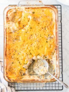 Hamburger potato casserole with a serving taken out.