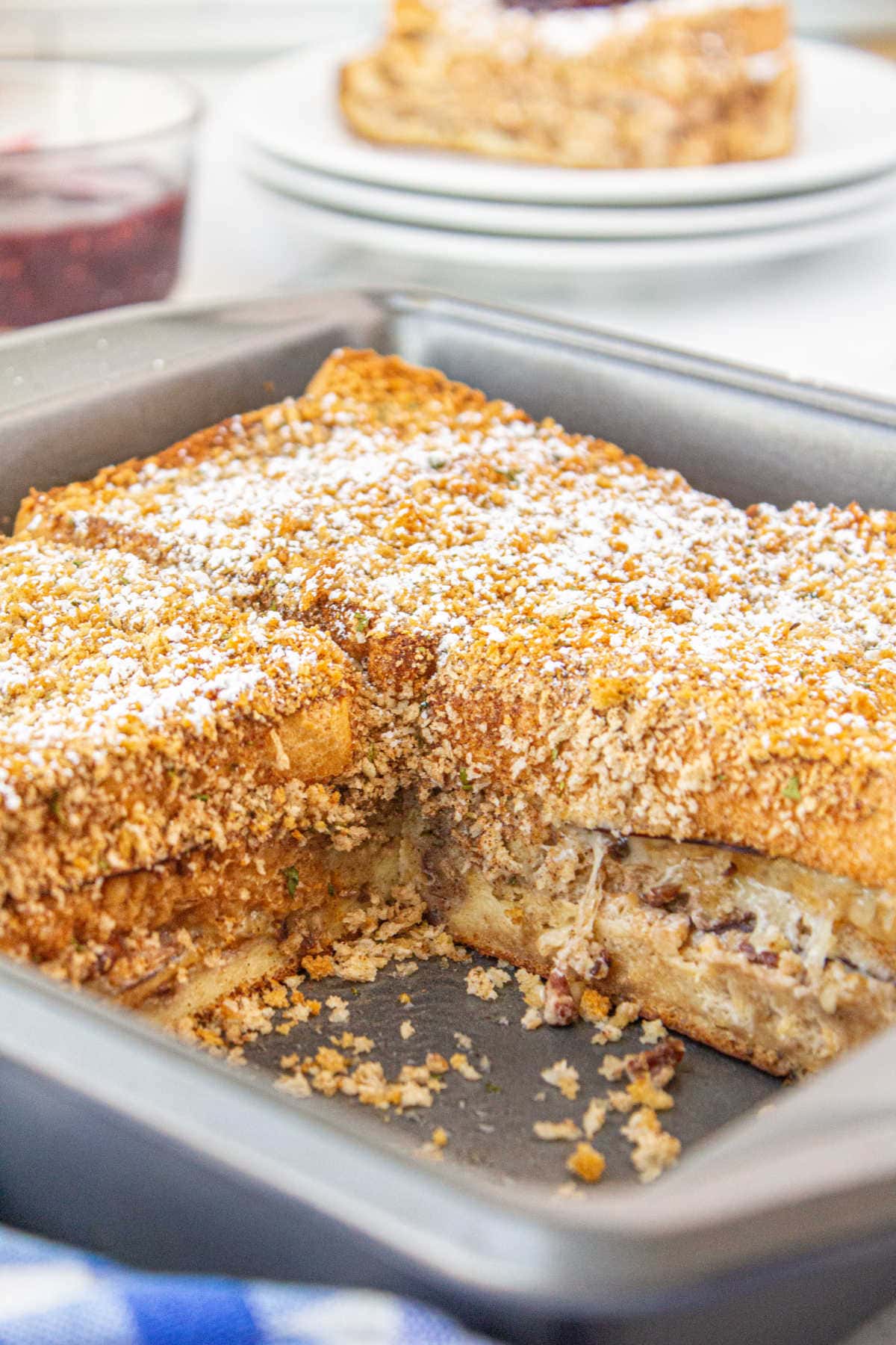 Monte Cristo casserole in the pan with a serving removed.