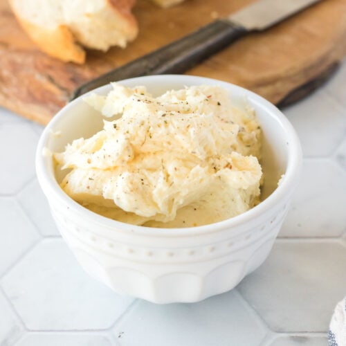 Garlic butter in small white bowl.