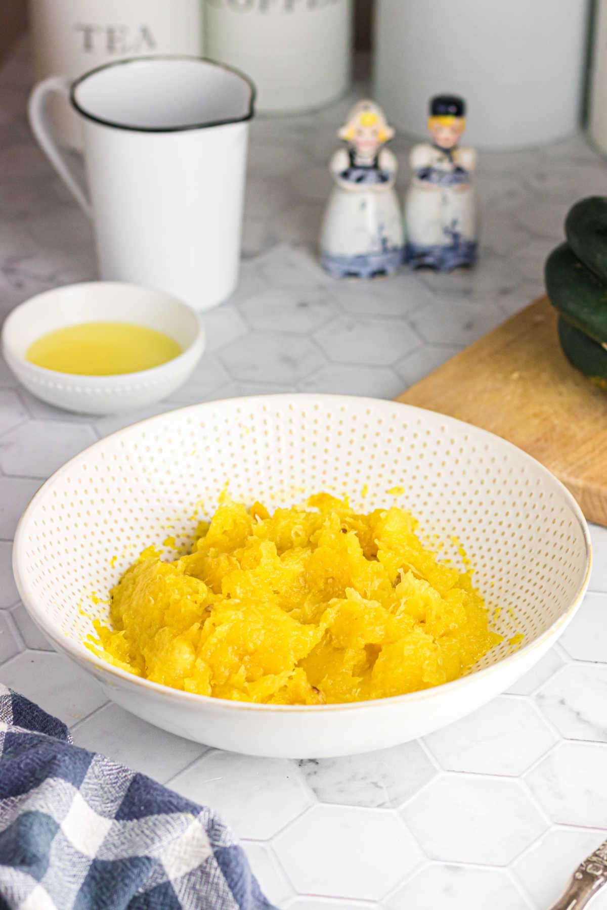 A bowl of acorn squash on the table.