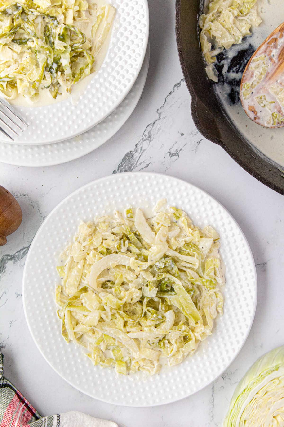 A serving of creamed cabbage on a plate.