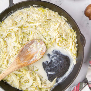 Overhead view of skillet with finished cabbage in it. Feature image.
