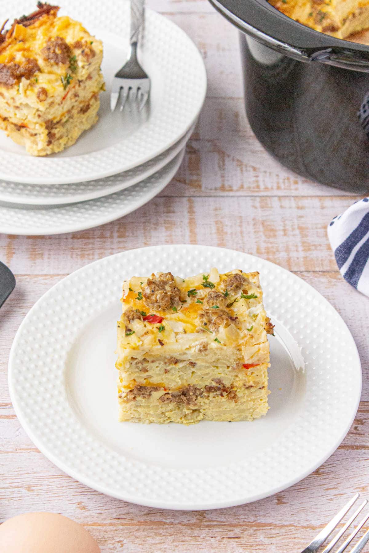 A serving of teh casserole on a plate showing the layers.