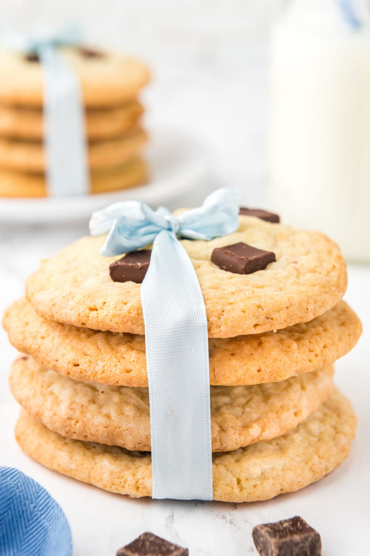 A stack of cookies tied with a blue ribbon.