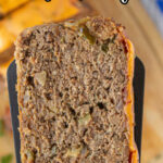 A serving of meatloaf with text overlay for Pinterest.