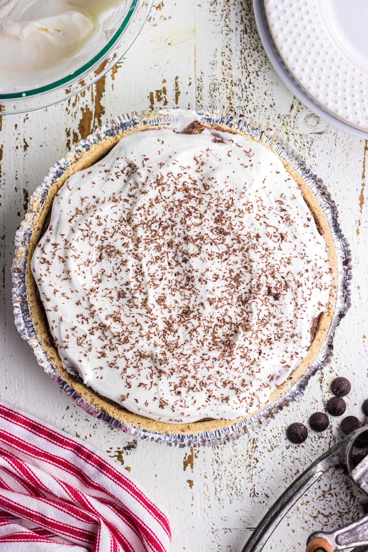 Overhead view of a whole, uncut pie showing the chocolate garnish.