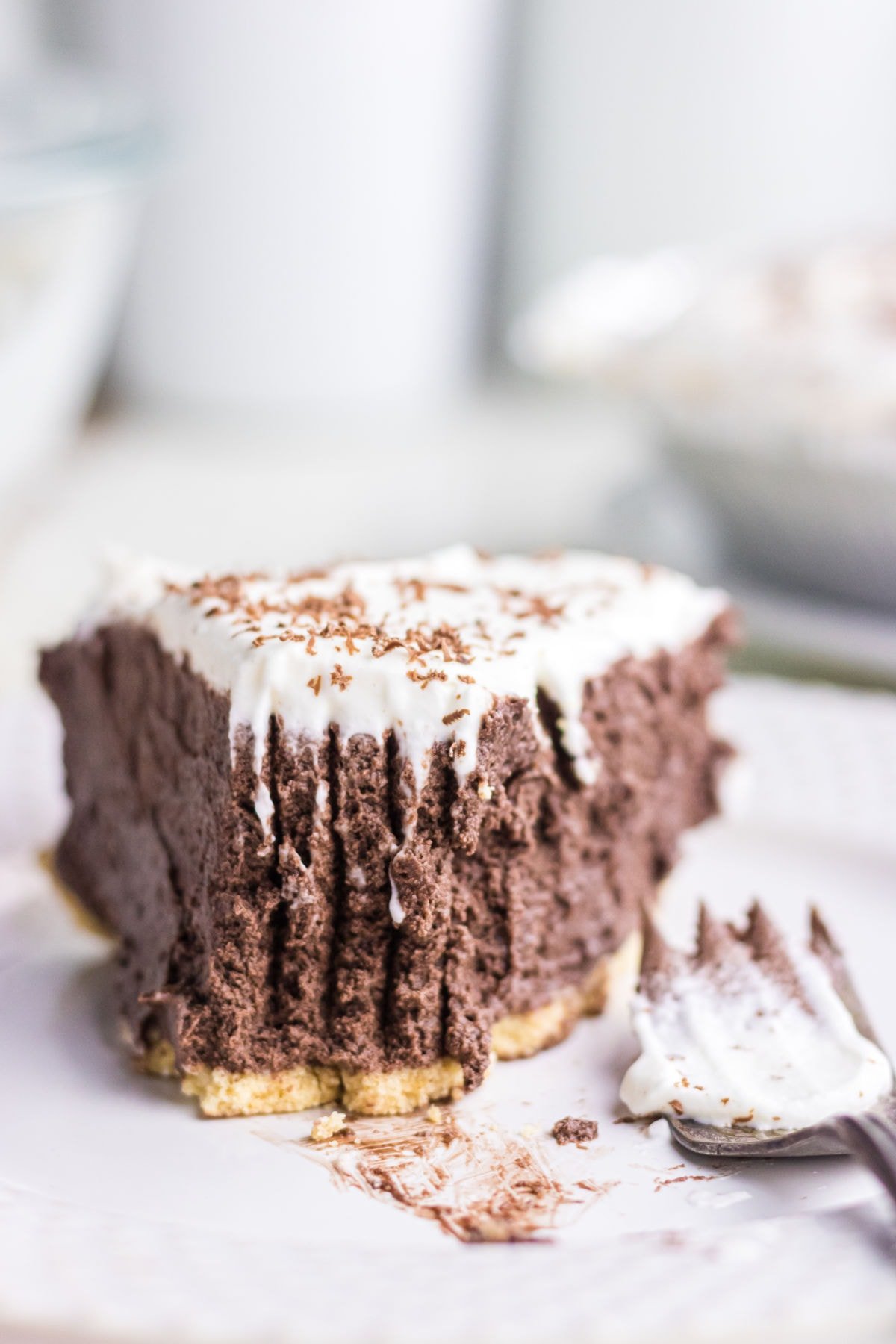 Creamy chocolate pie with fork lines in it.