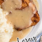 Closeup of fried pork chops and gravy with text overlay for Pinterest.
