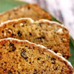 Slices of banana bread on a plate with a text overlay for Pinterest.