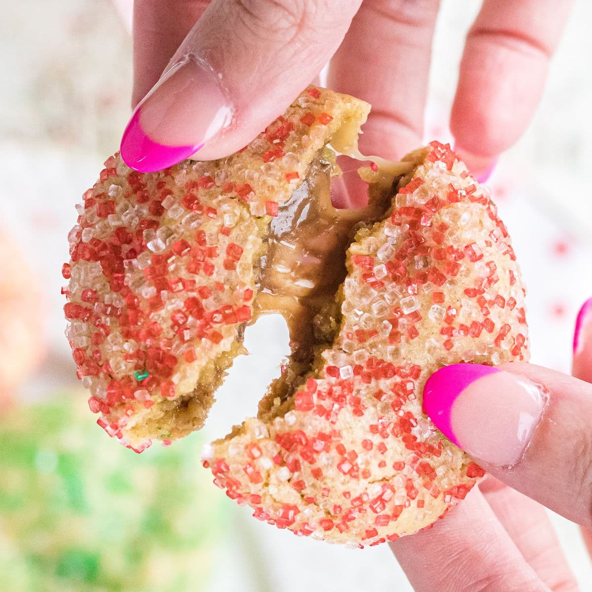 Broken cookie showing the gooey caramel insides.