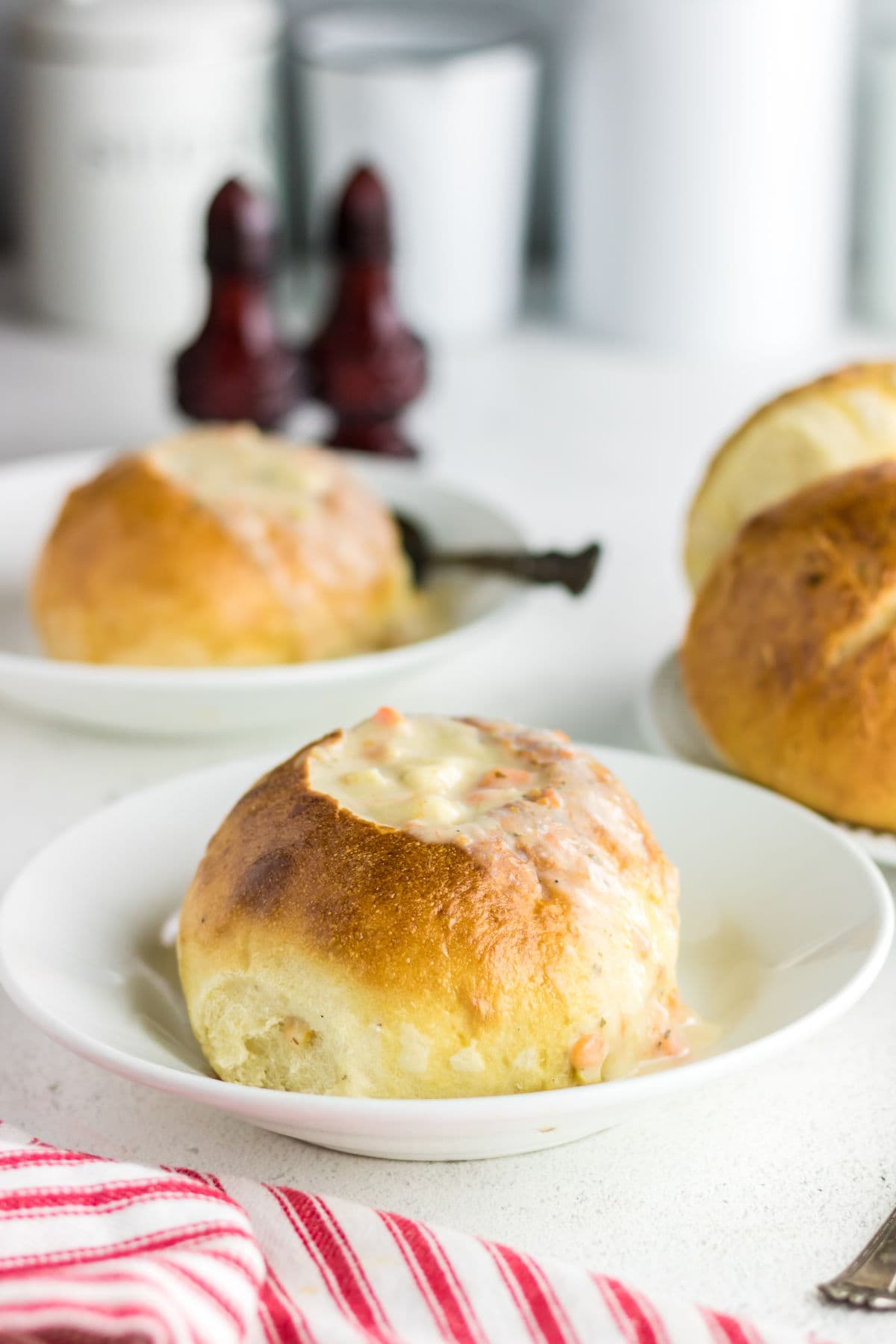 Finished bread bowls filled with soup.