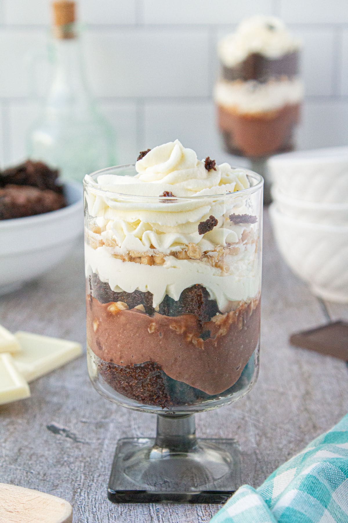Personal size brownie trifle parfaits in wine glasses.