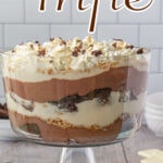The finished layered dessert in a glass dish with text overlay for Pinterest.