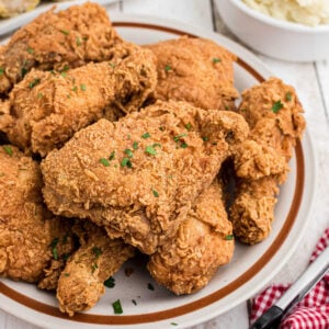 Closeup of fried chicken on a plate.
