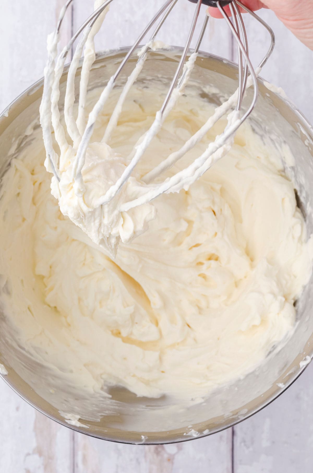 A bowl of cream cheese frosting.