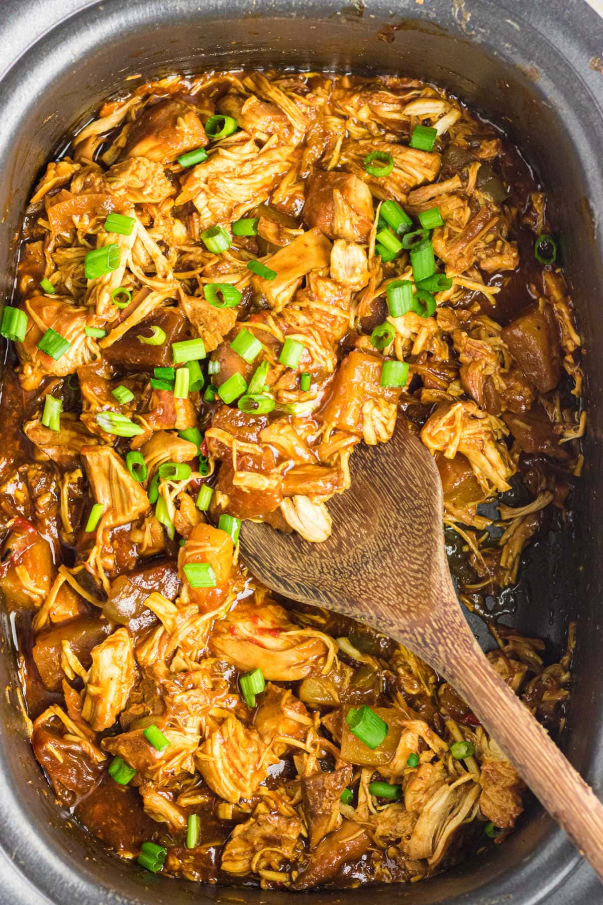 Overhead view of the finished chicken recipe in the crockpot.