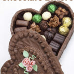 A box made of chocolate with truffles inside and a text overlay for Pinterest.