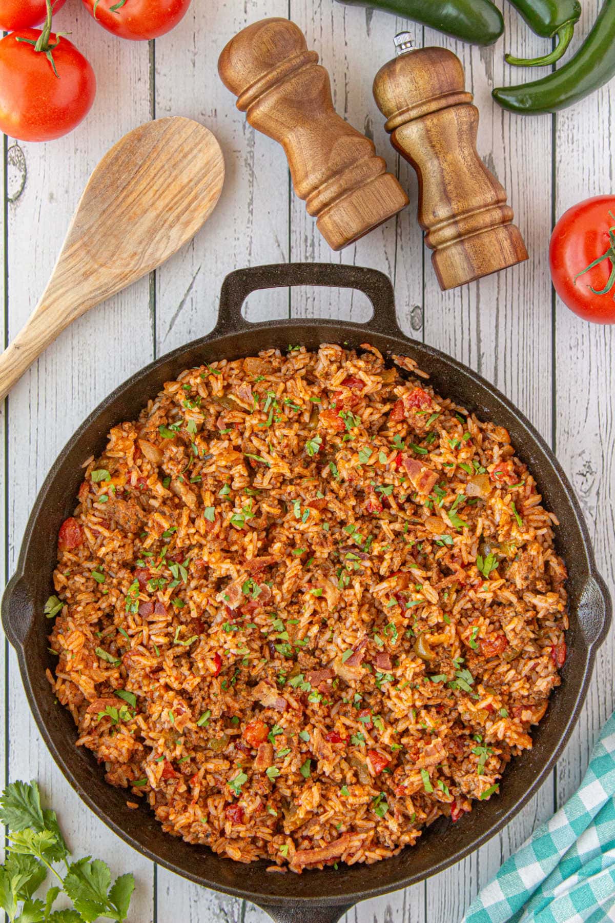 Overhead view of Spanish rice in an. iron skillet.